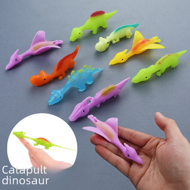 Kreativ dinosaurie-fingerkatapult som stressleksak